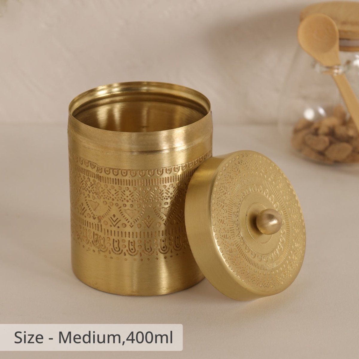 Handcrafted pure brass storage jar with traditional etching, ideal for kitchen storage, adding timeless Indian elegance.