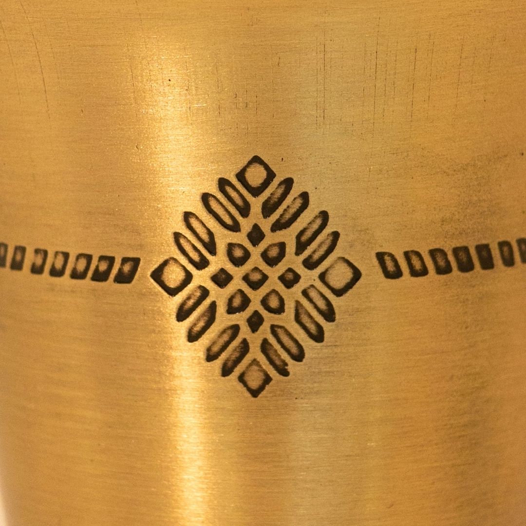 Handcrafted pure brass kitchen masala box with Kanjeevaram-inspired etching, adding timeless Indian elegance.