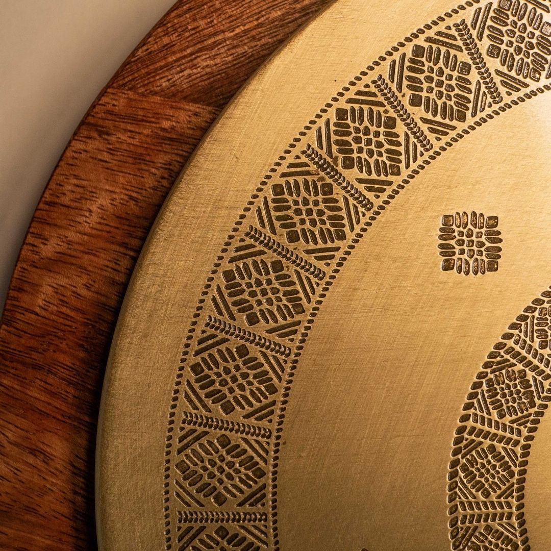 Handcrafted pure brass kitchen masala box with Kanjeevaram-inspired etching, adding timeless Indian elegance.