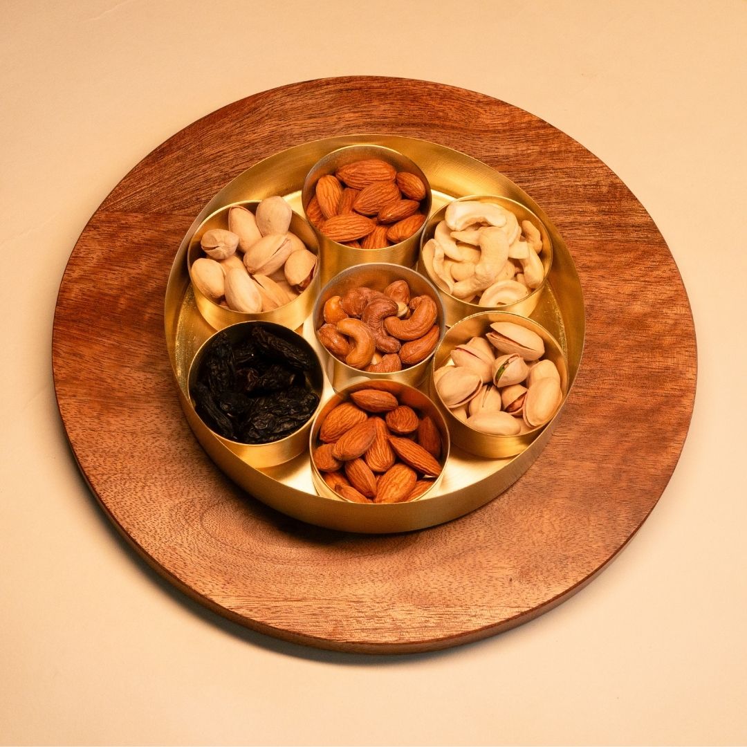 Handcrafted pure brass kitchen masala box with Kanjeevaram-inspired etching, adding timeless Indian elegance.