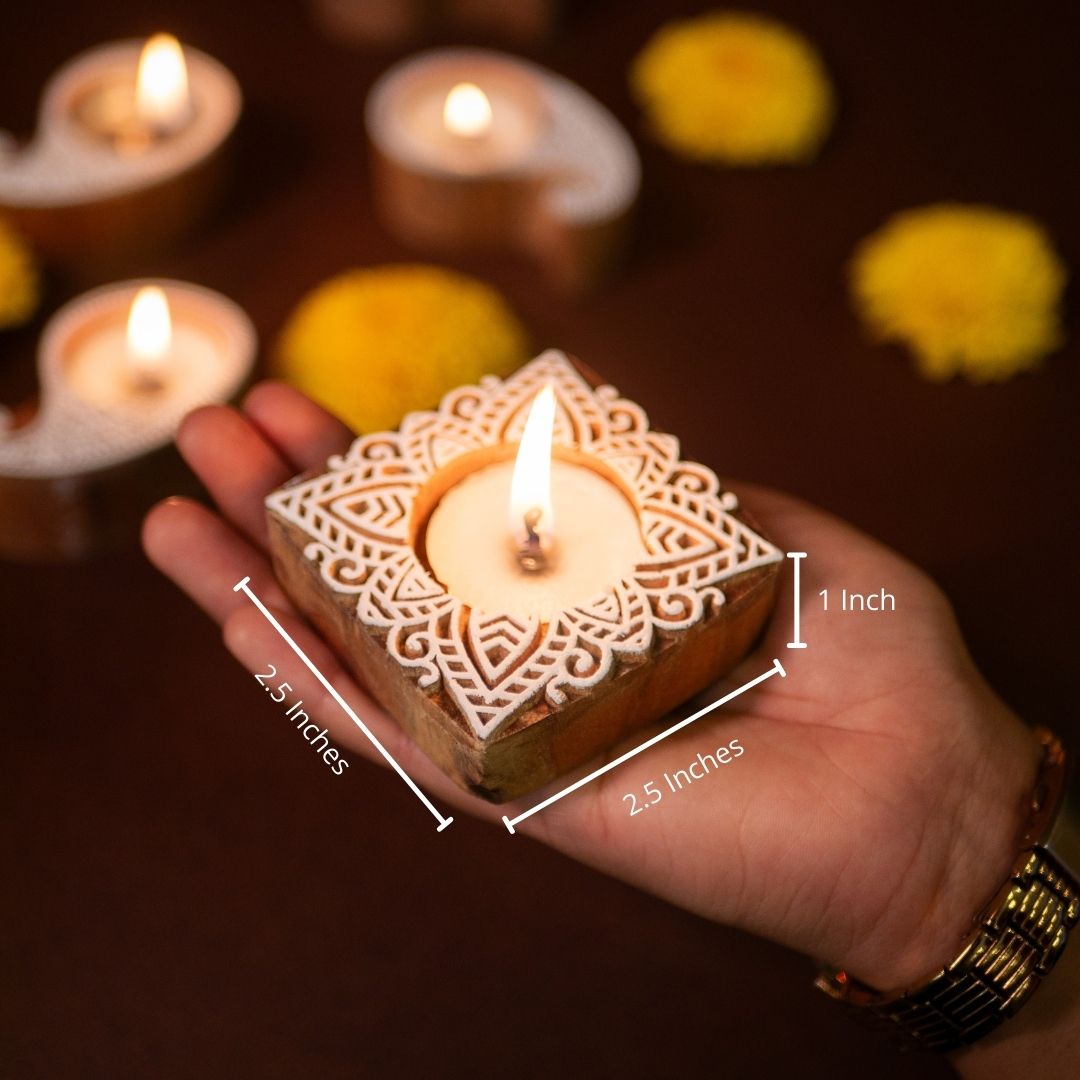Hand-engraved mango wood diya set with tea lights in white and brown, set of 6, ideal for festive home décor and gifting.