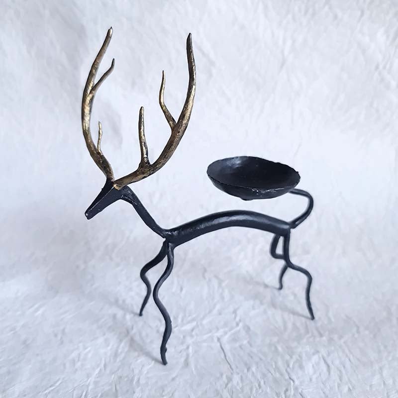 Handcrafted Bastar wrought iron golden deer tealight holders. Set of 2 artisan pieces for warm, elegant home décor.