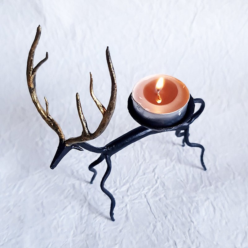 Handcrafted Bastar wrought iron golden deer tealight holders. Set of 2 artisan pieces for warm, elegant home décor.