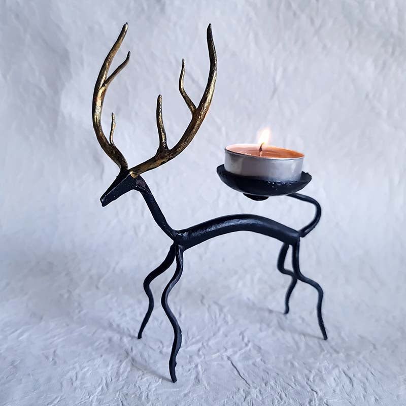 Handcrafted Bastar wrought iron golden deer tealight holders. Set of 2 artisan pieces for warm, elegant home décor.