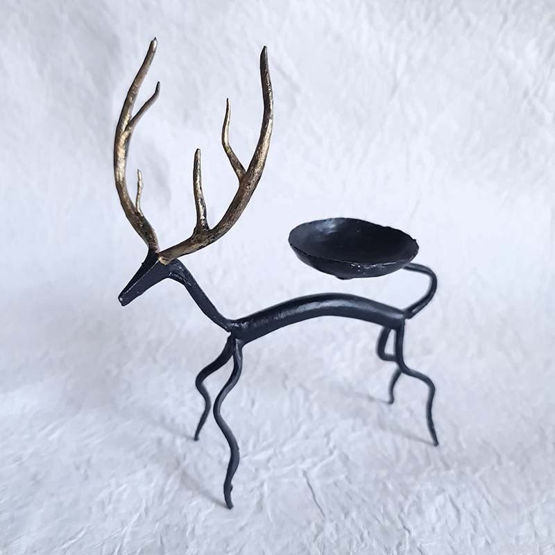 Handcrafted Bastar wrought iron golden deer tealight holders. Set of 2 artisan pieces for warm, elegant home décor.