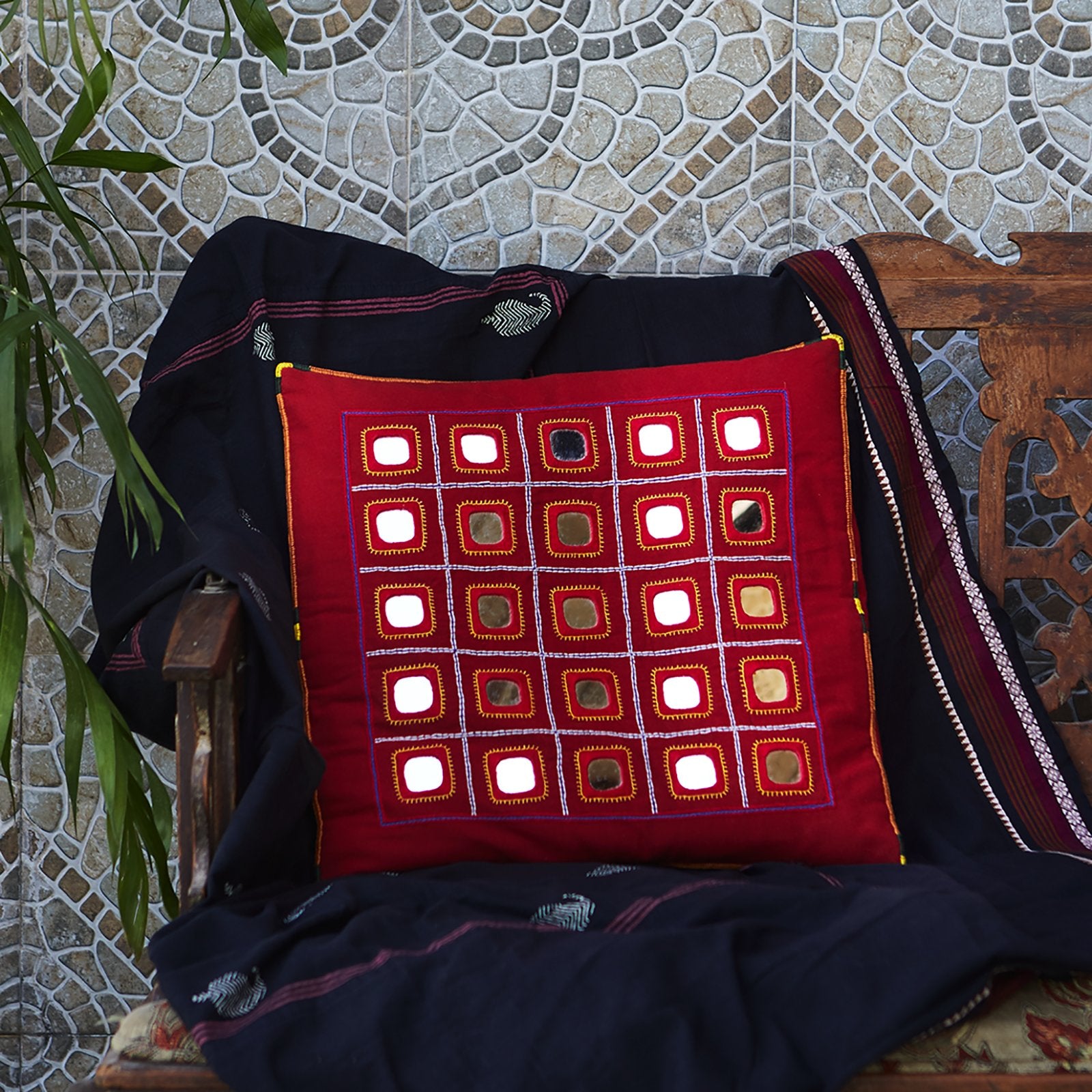 Red Lambani Starlight cushion cover, showcasing traditional artistry