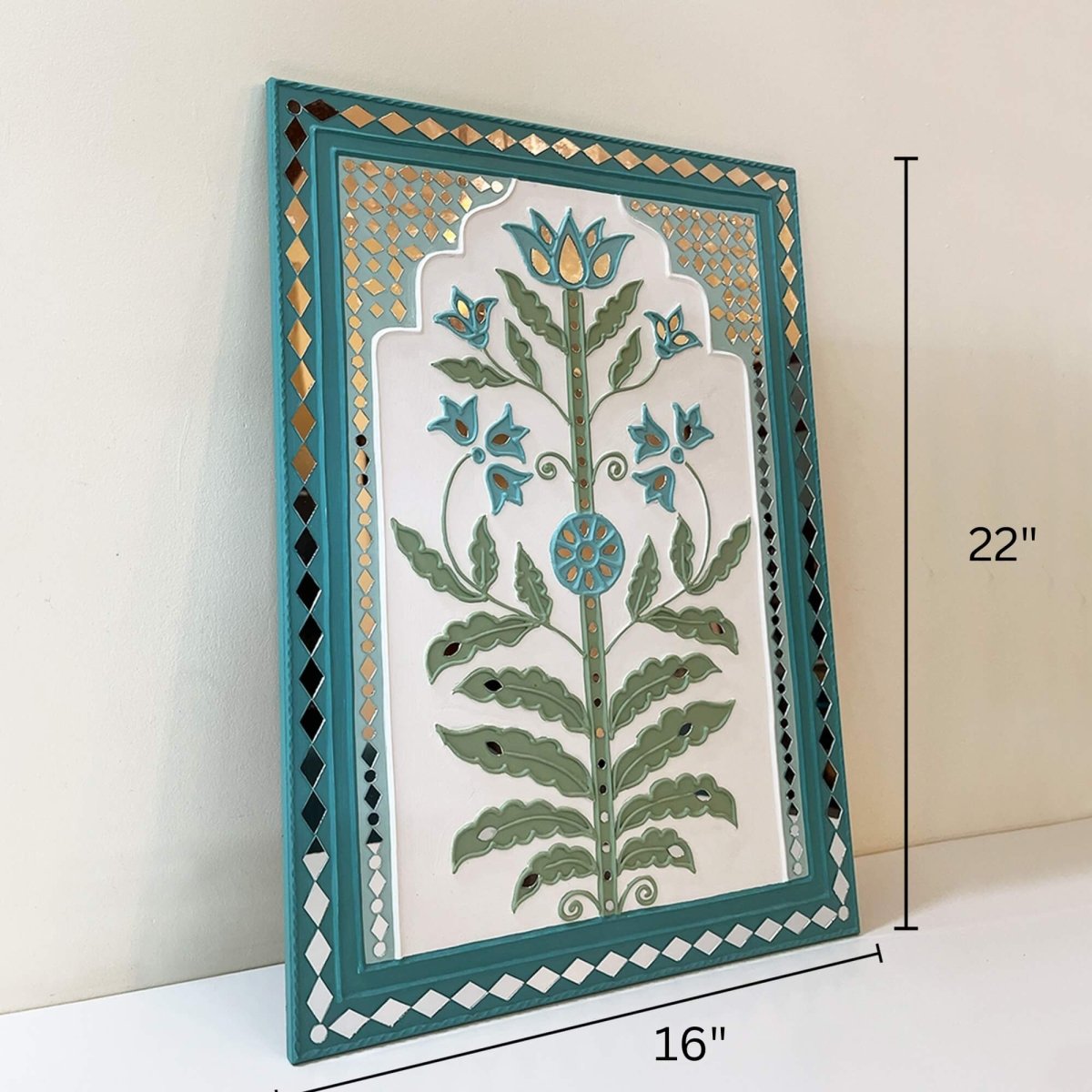 Handmade white & light green lippan wall hanging with mud and mirror work from Kutch.