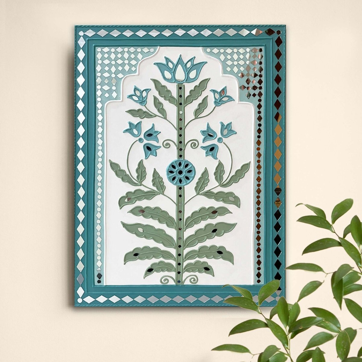 Handmade white & light green lippan wall hanging with mud and mirror work from Kutch.