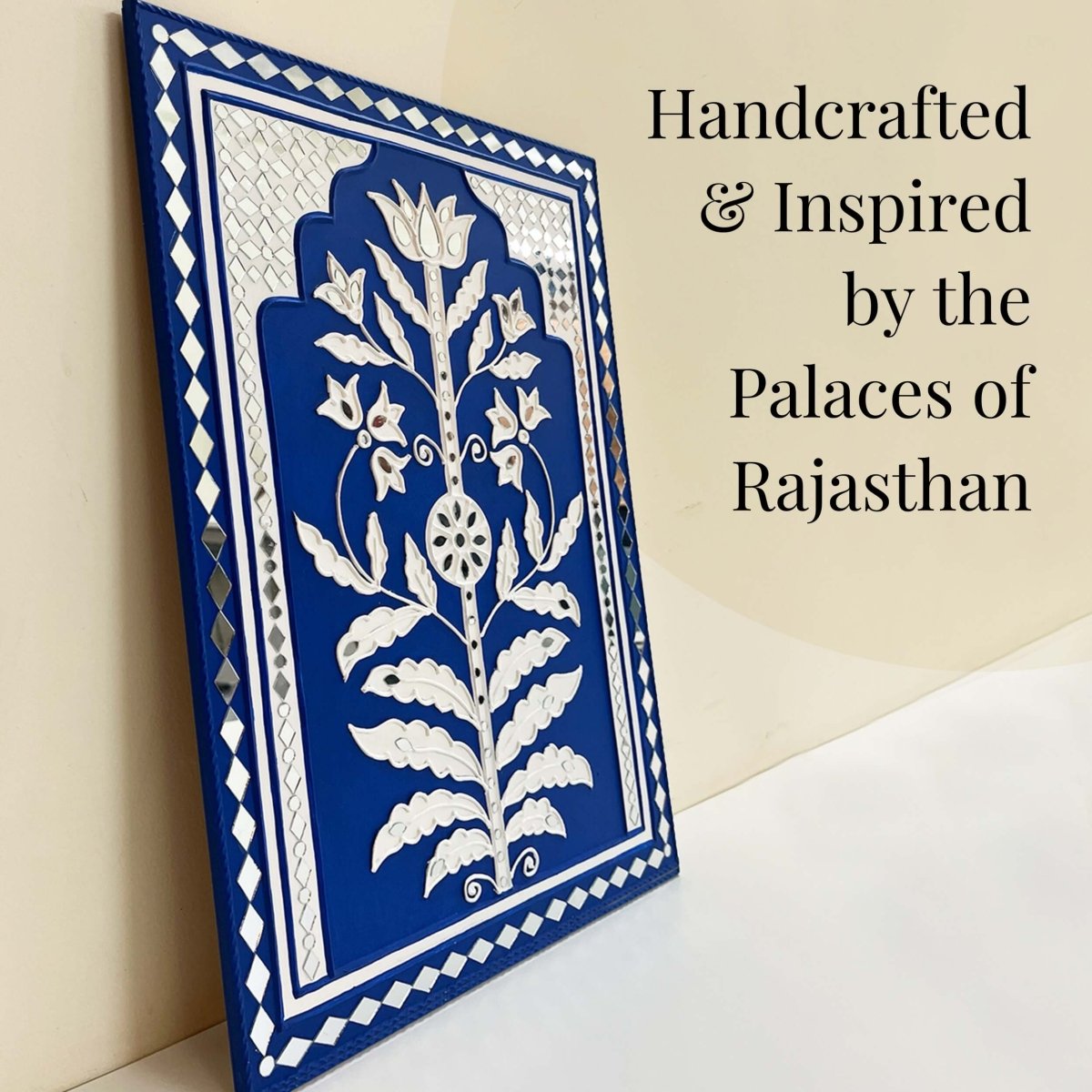 Handmade blue sparkle mud art wall hanging crafted with mud and mirrors from Kutch.