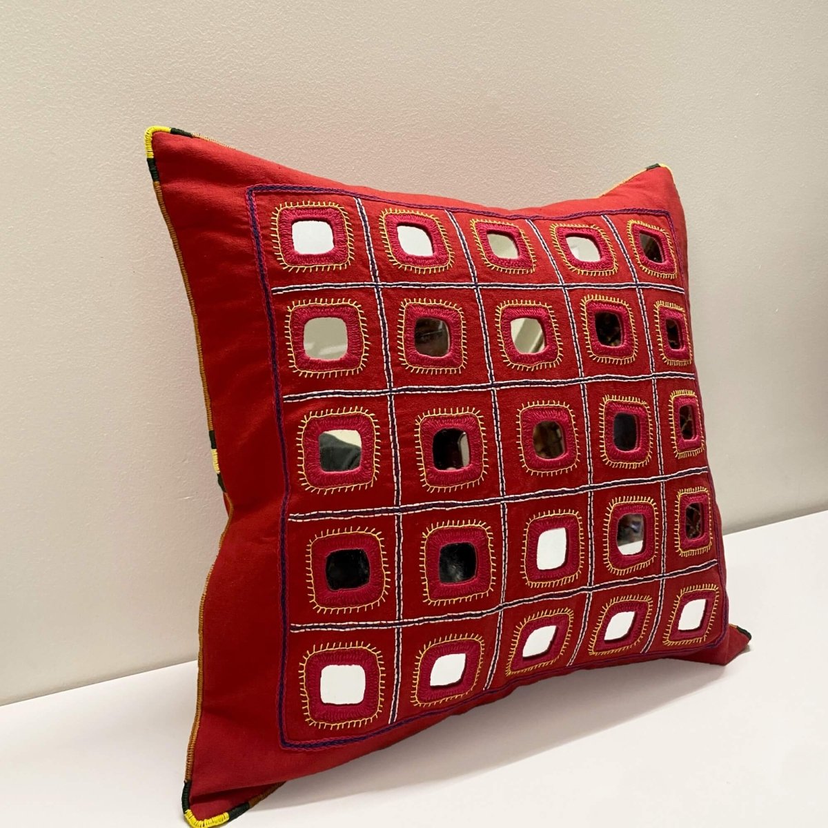 Red Lambani Starlight cushion cover, showcasing traditional artistry