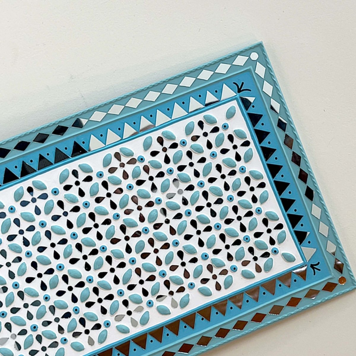 Handmade ocean blue Lippan wall hanging with mud and mirror work from Kutch.