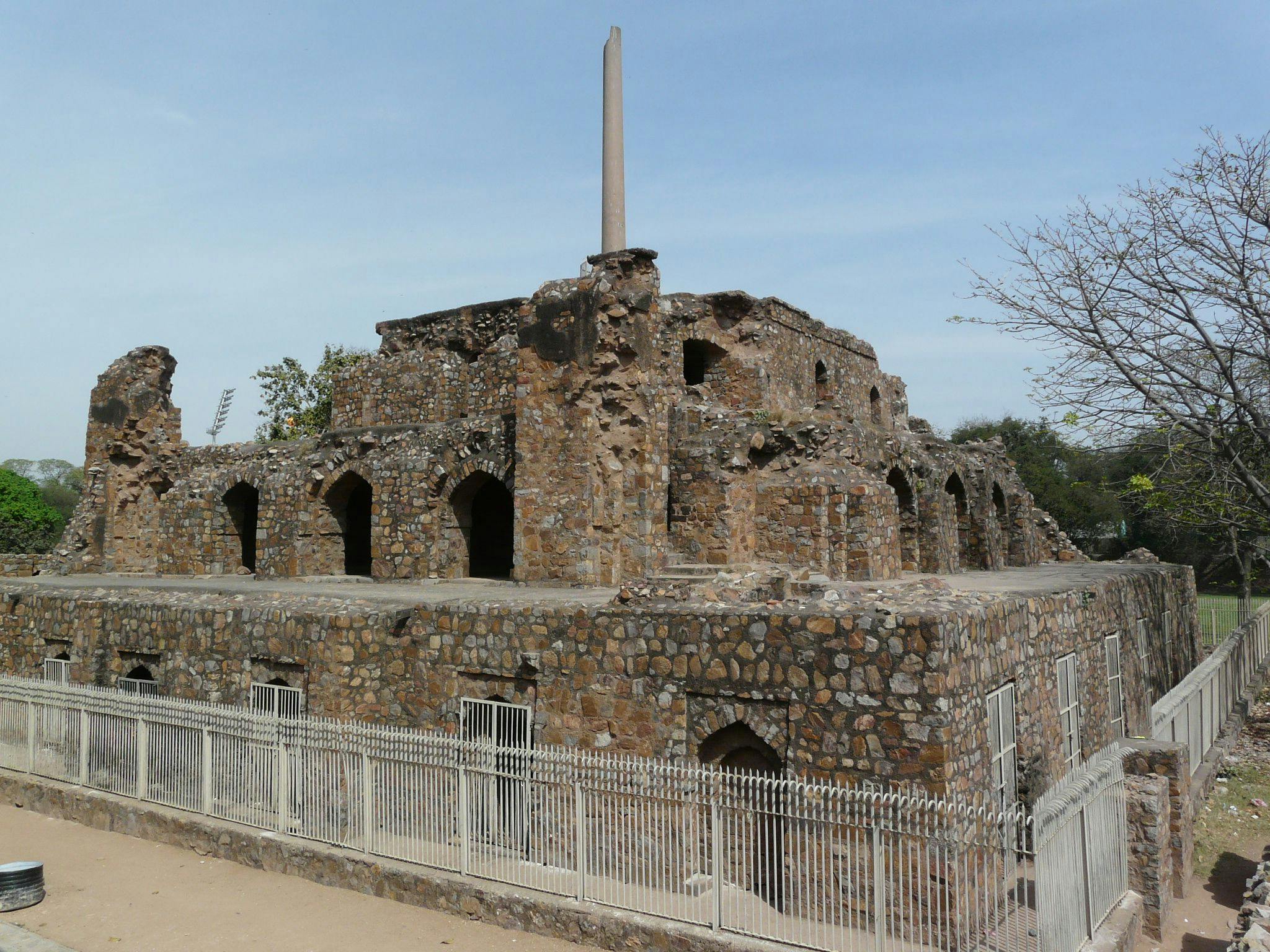 Ashokan Pillar at the palace ruins in Feroz Shah Kotla, called the Delhi-Topra pillar