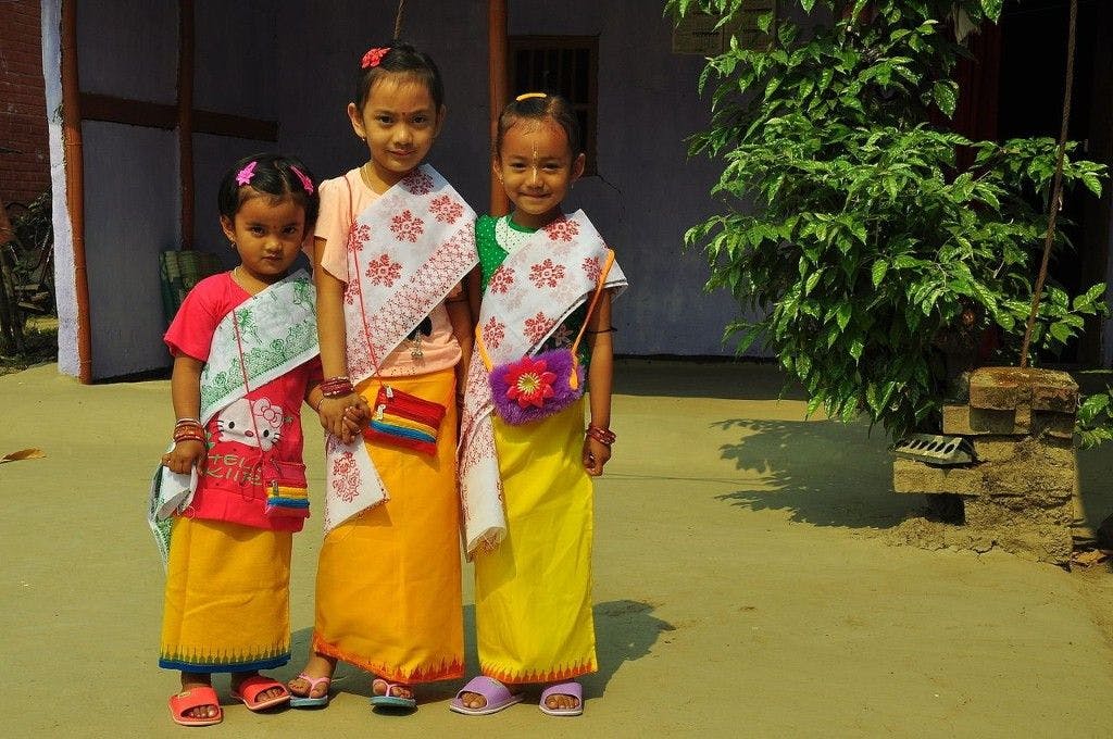 Young girls dressed for the Yaosang festival