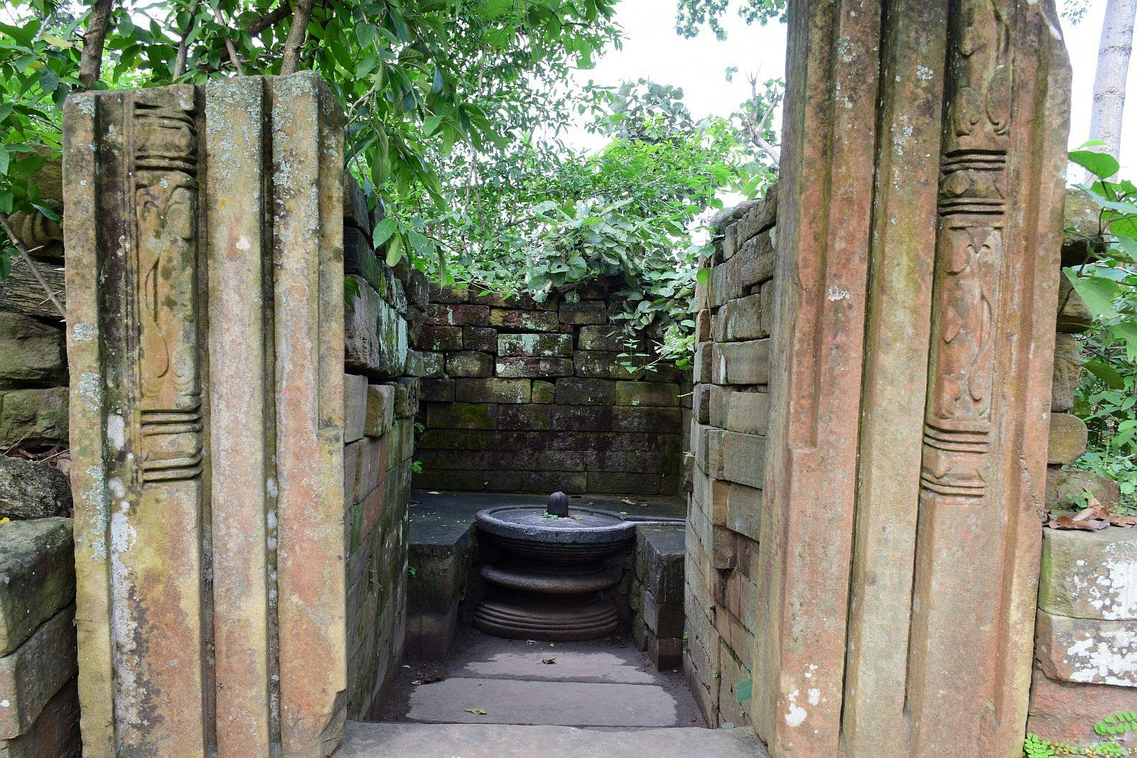 Ruined stone temple with Shivalingam