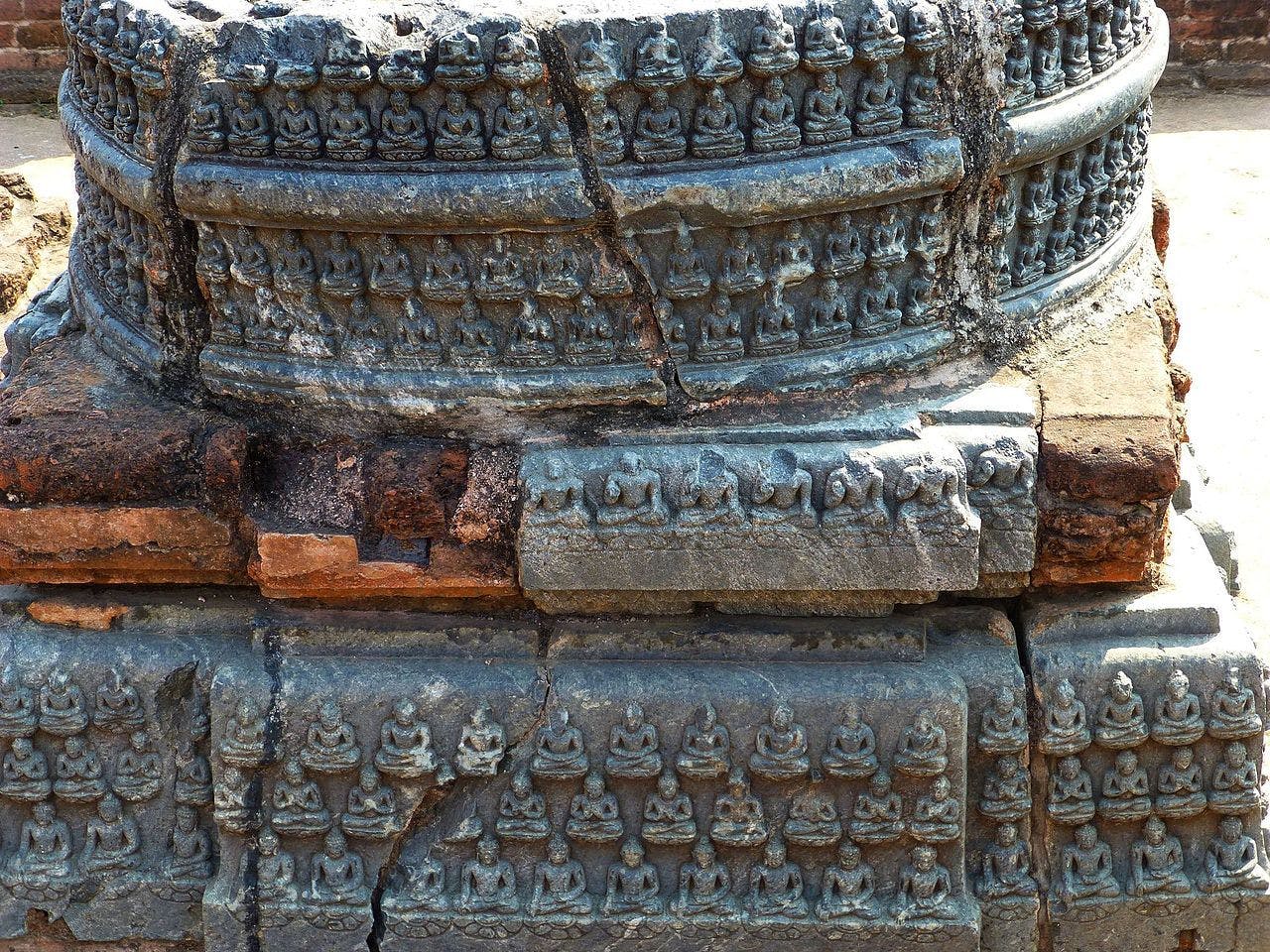 Detailing on a votive stupa, it shows Buddhas in different Mudras