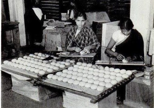 Cakes of Mysore soap are being wrapped at a factory in Bangalore