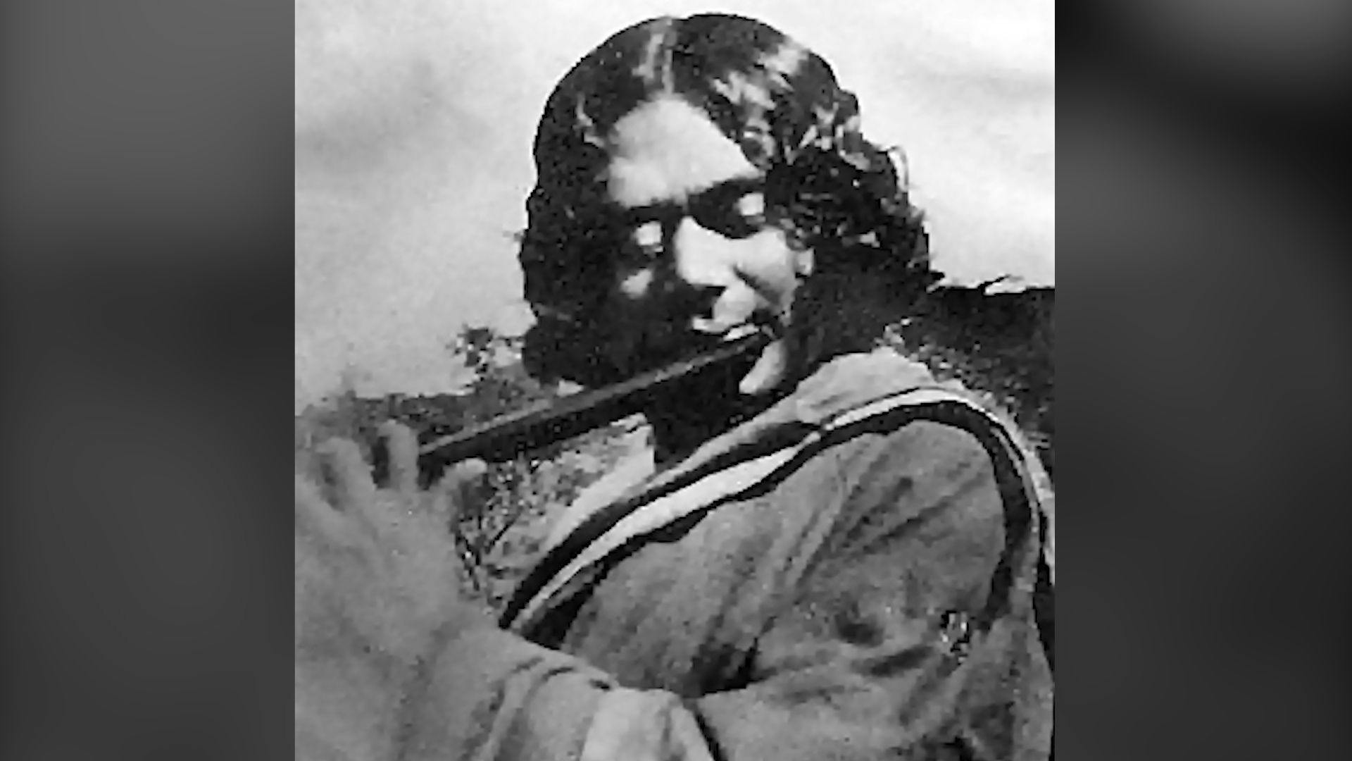 Nazrul playing the flute