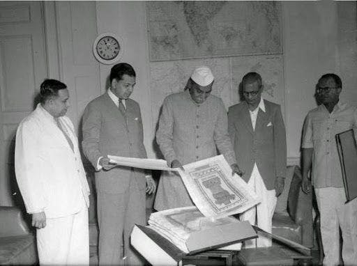 Dr Rajendra Prasad examining the handwritten manuscript of Prem Behari Narain Raizada 