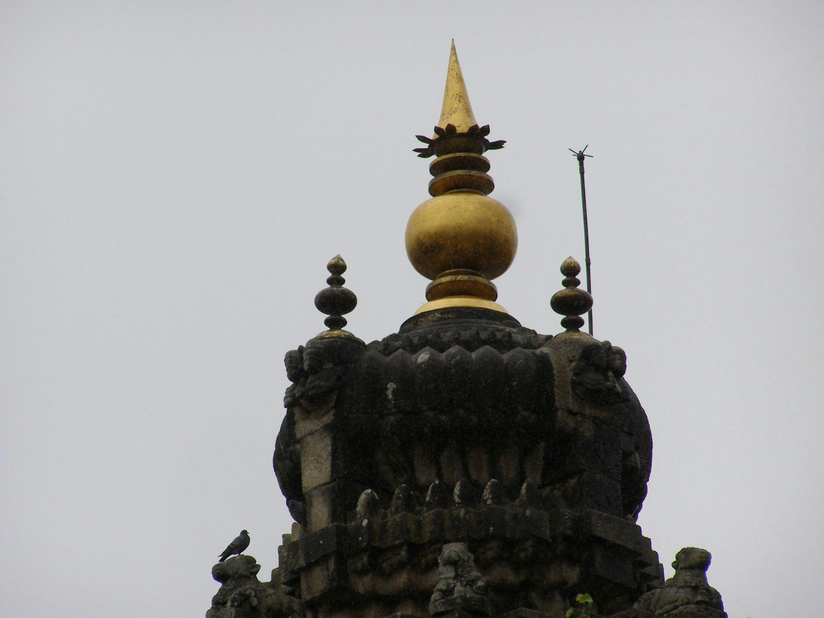 The finial crowning the spire