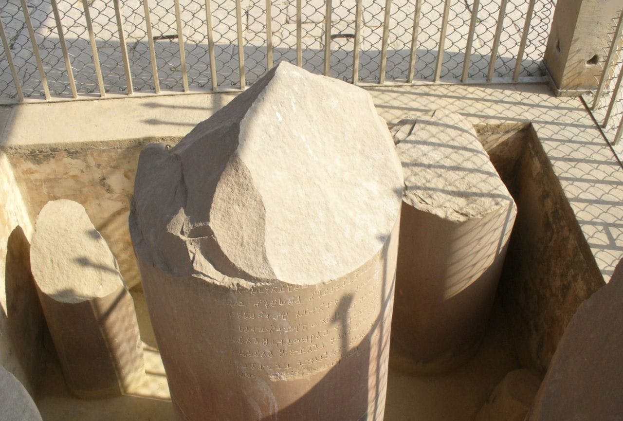 Ashoka pillar fragments with inscription displayed in Sarnath