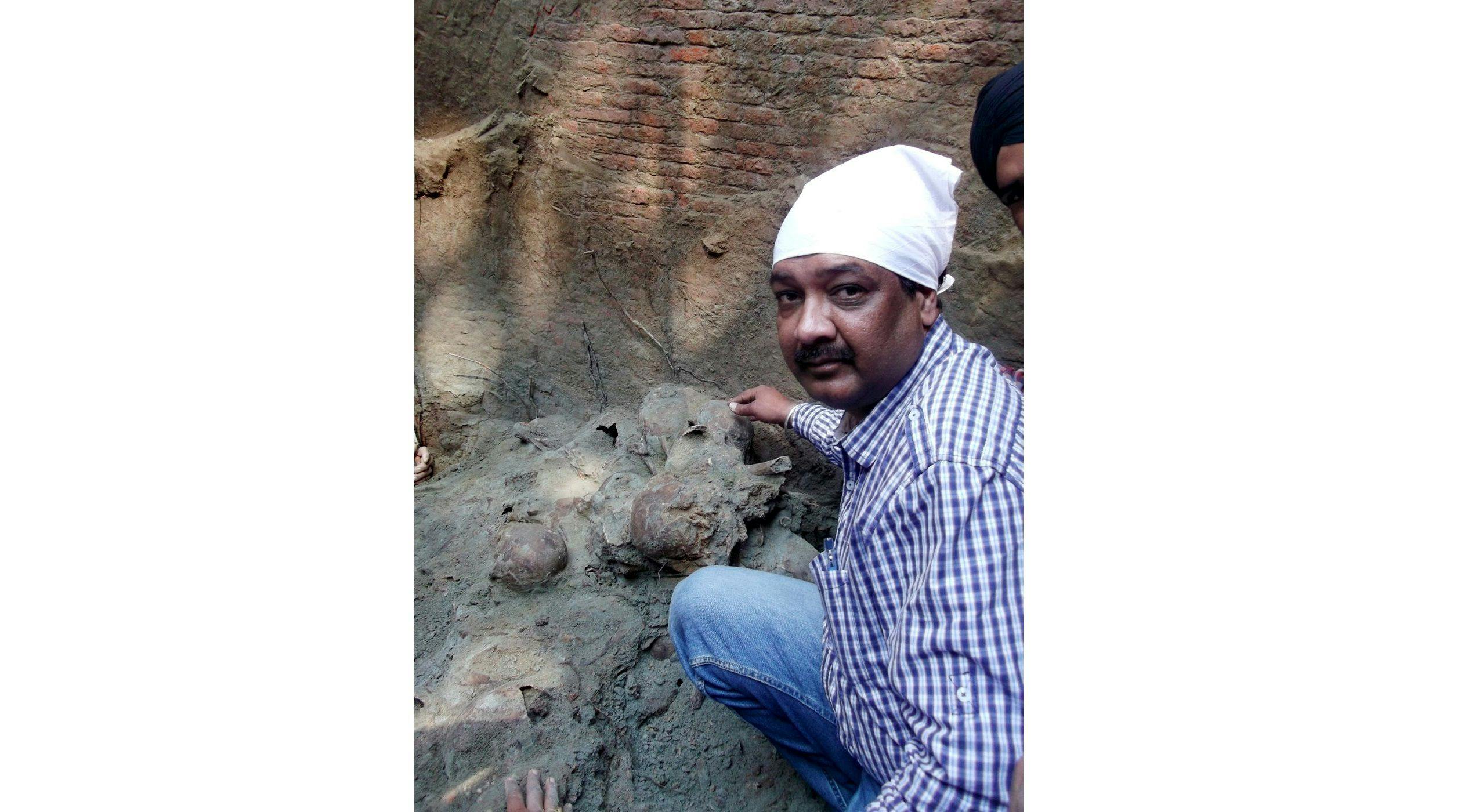 Historian Surinder Kochhar with the findings from the well 