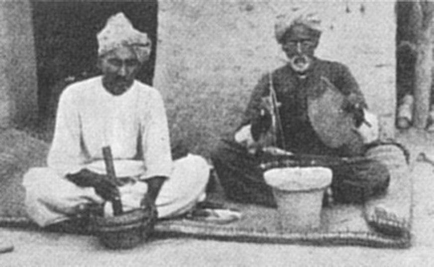 Making etched carnelian beads in modern times in Sehwan: one mixes the alkali formula in a mortar while the other prepares a brasero (Mackay, 1933)