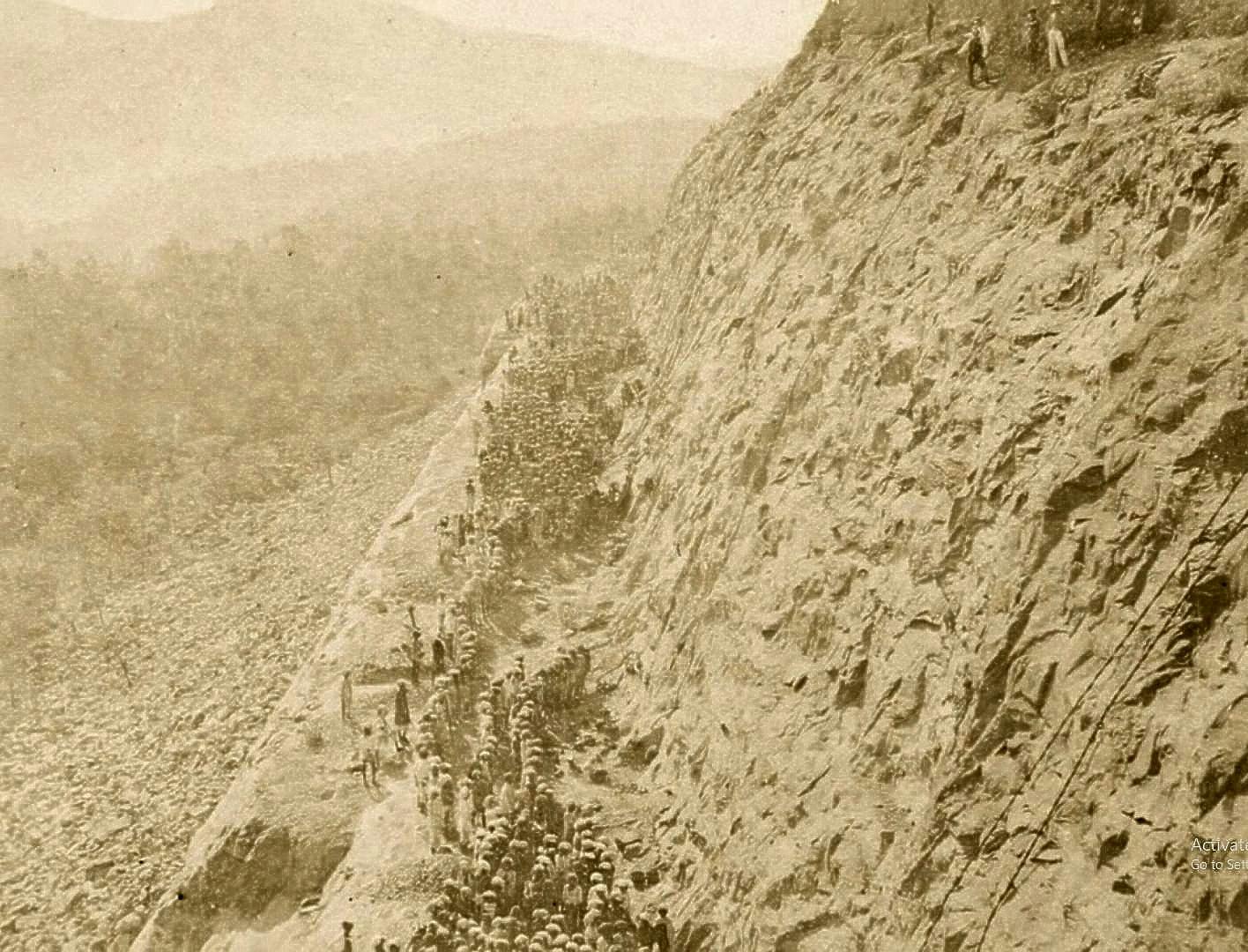Men working on steep cliffs