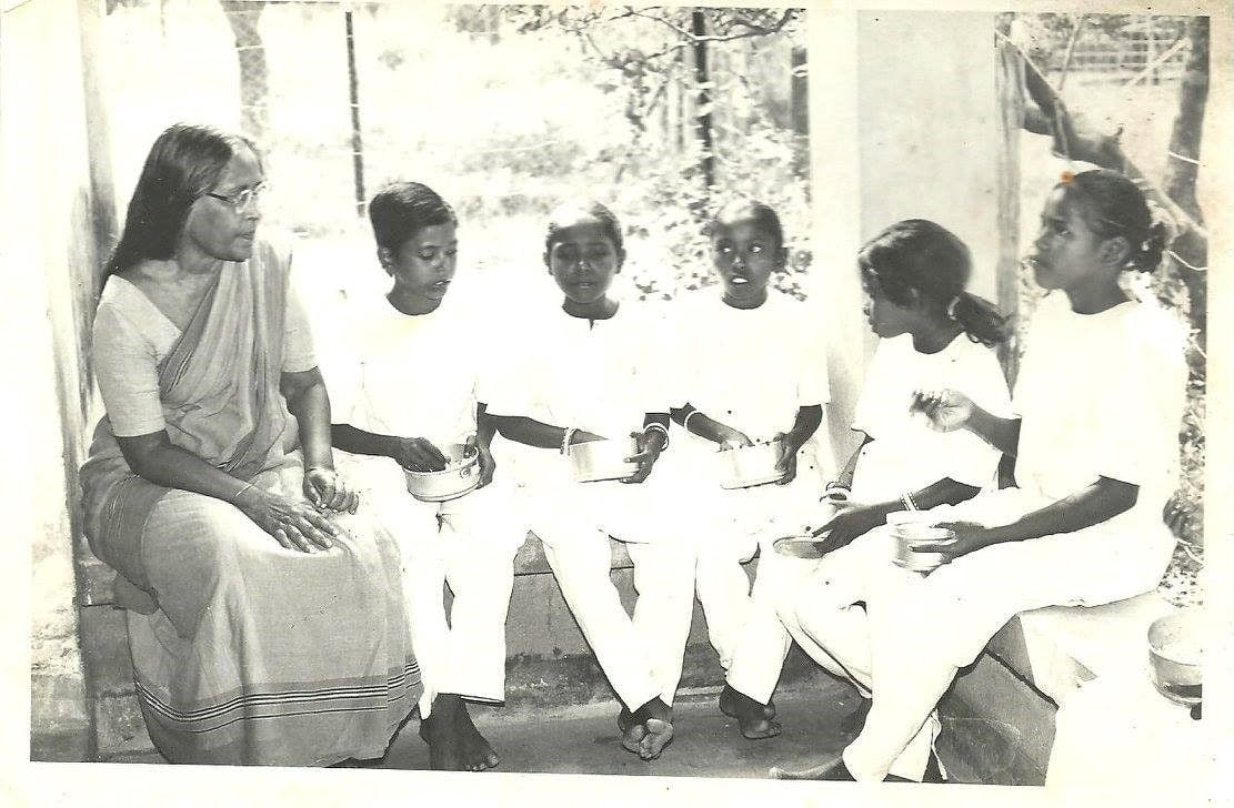 Dr. Purnima Sinha with tribal students of Mela Mesha r Pathashala at Shantiniketan