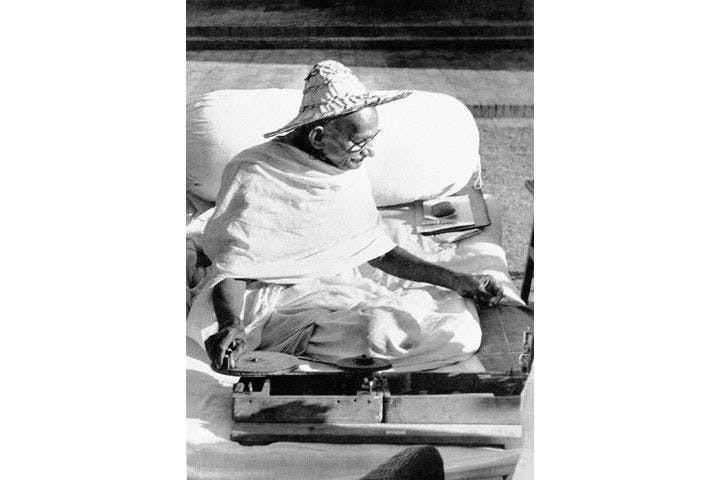 Gandhi, spinning in Noakhali
