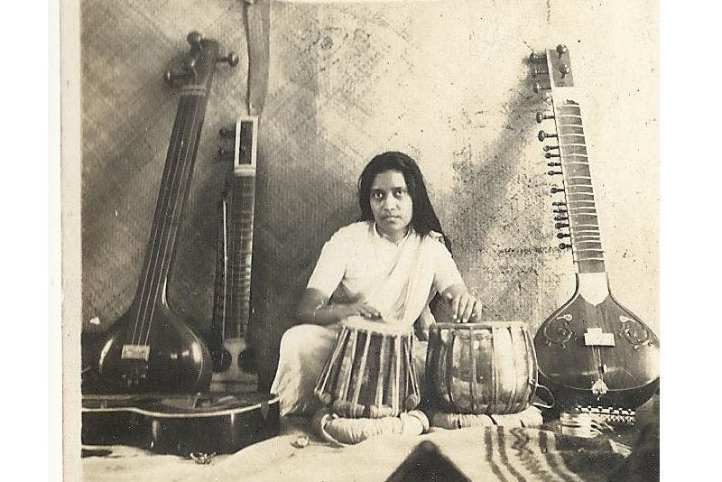 Dr. Purnima Sinha as a percussionist playing Tabla