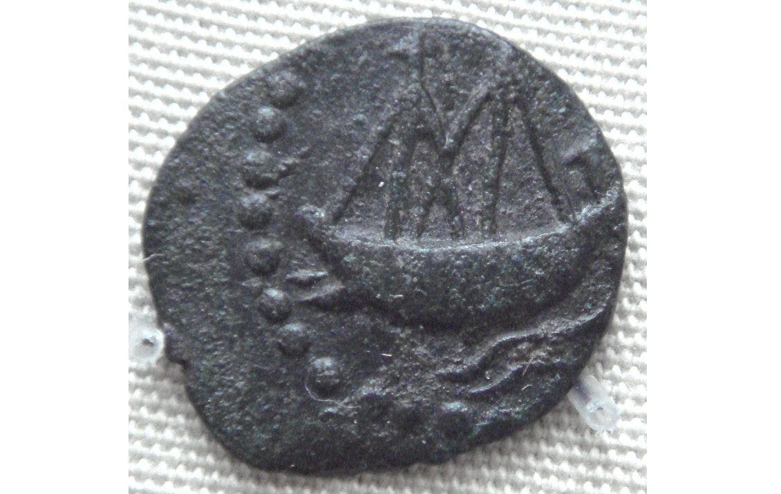 Satavahana coin with two masted ship with steering oars