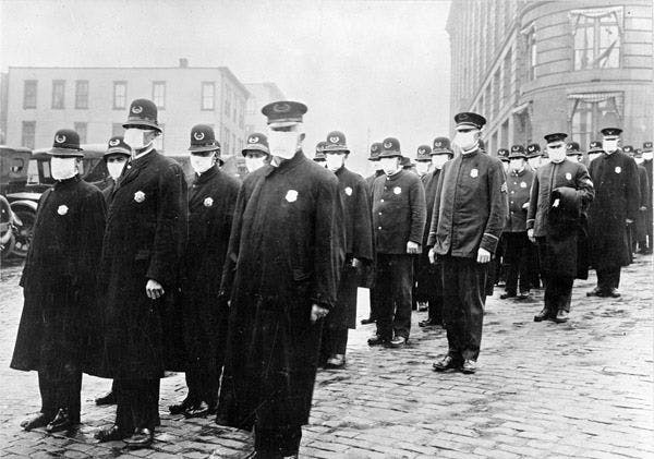 Policemen in Seattle (United States of America) wearing masks made by the Red Cross, during the Spanish influenza epidemic, December 1918