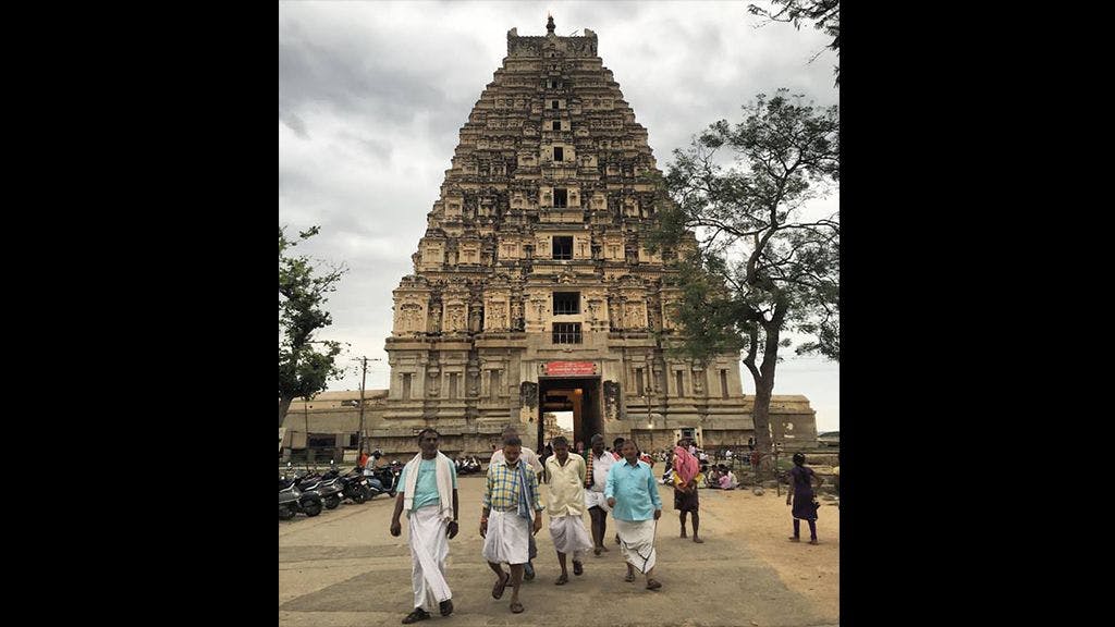 The gorgeous gopuram of Virupaksha temple towering above the locals of Hampi