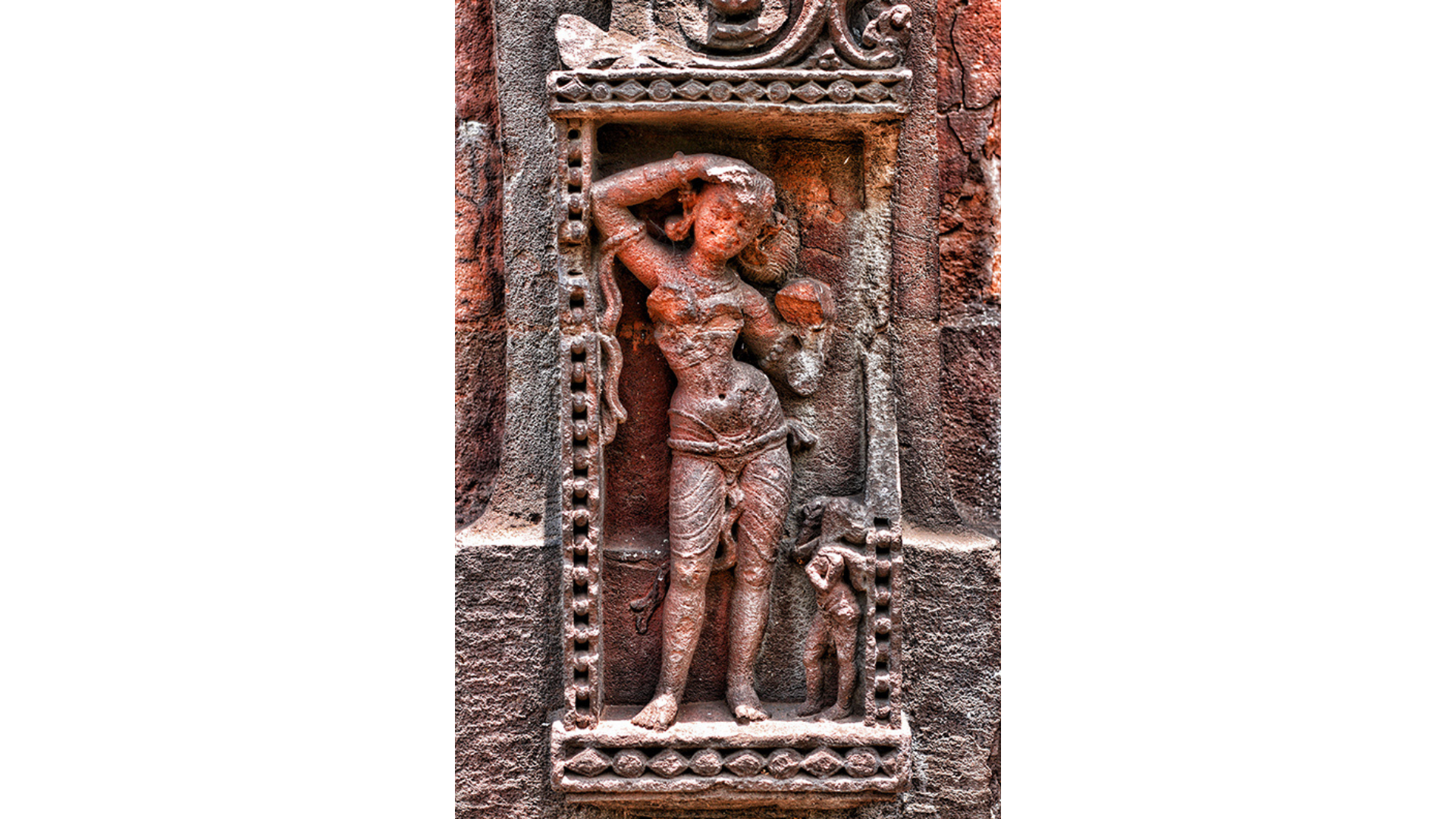 The temple’s walls are adorned with elegant and complex carvings of female figures in various moods