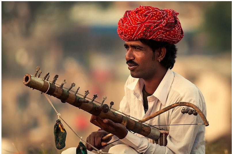 A Bhopa playing a musical instrument called Ravanhatta