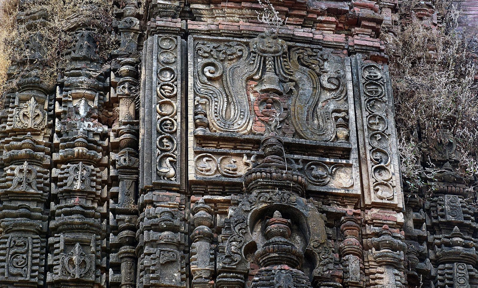 Decoration with kirtimukha and geese over the entrance of the first temple
