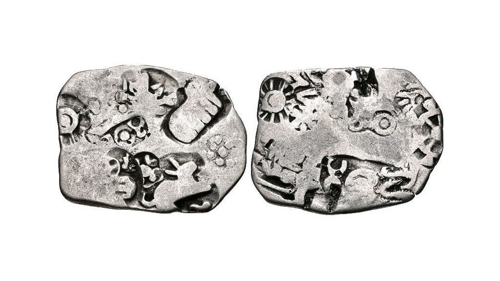 Coins of Magadha Janapada with rabbit, elephant (L) and wheel (R)
