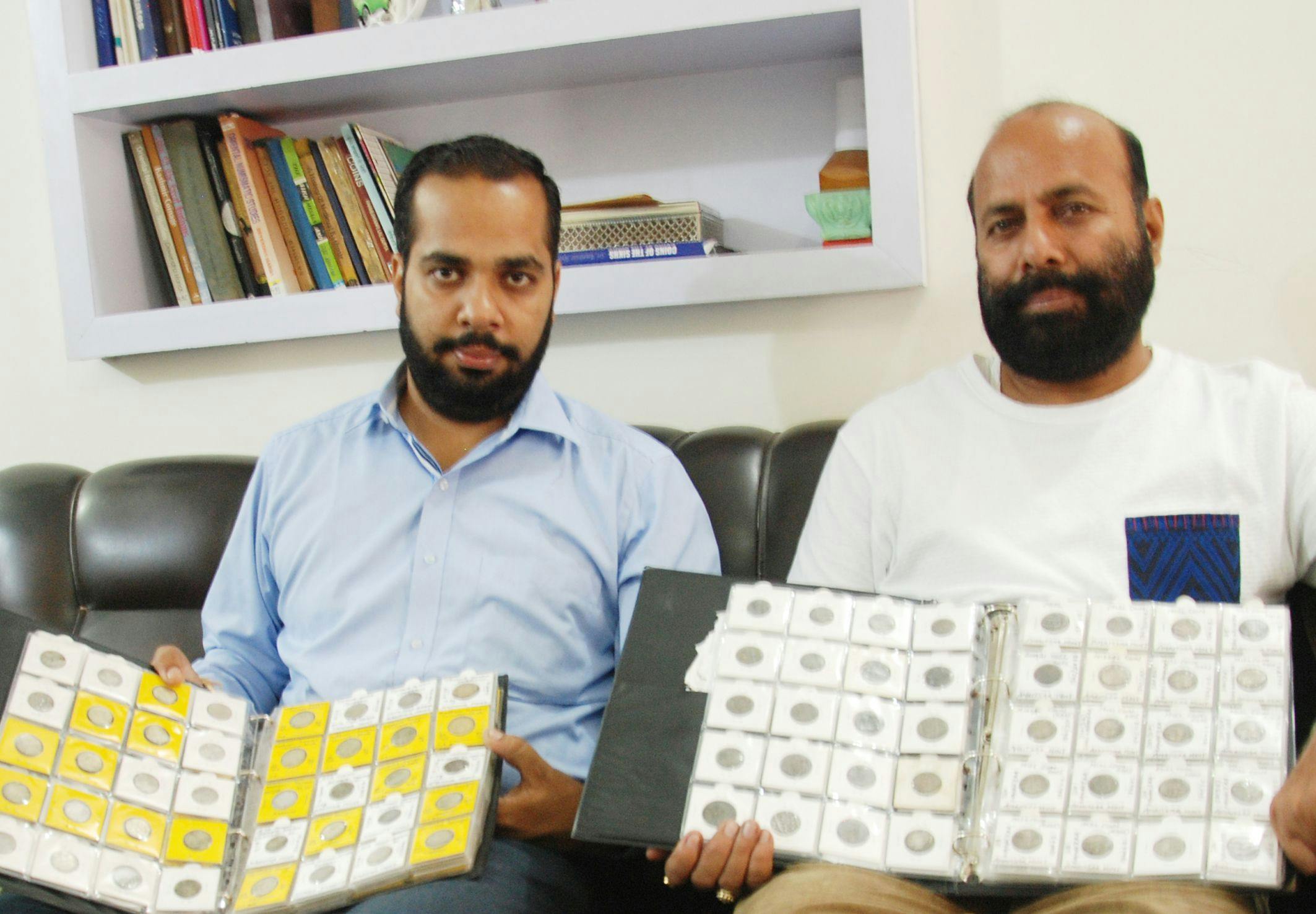 Prateek Sehdev and Dev Dard, along with Sikh coins