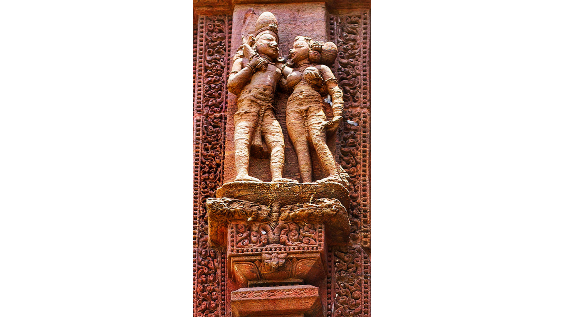 Sculptures of women and other figures in various poses on the walls of the temple. These are strikingly similar to those found in the Khajuraho temples in Madhya Pradesh