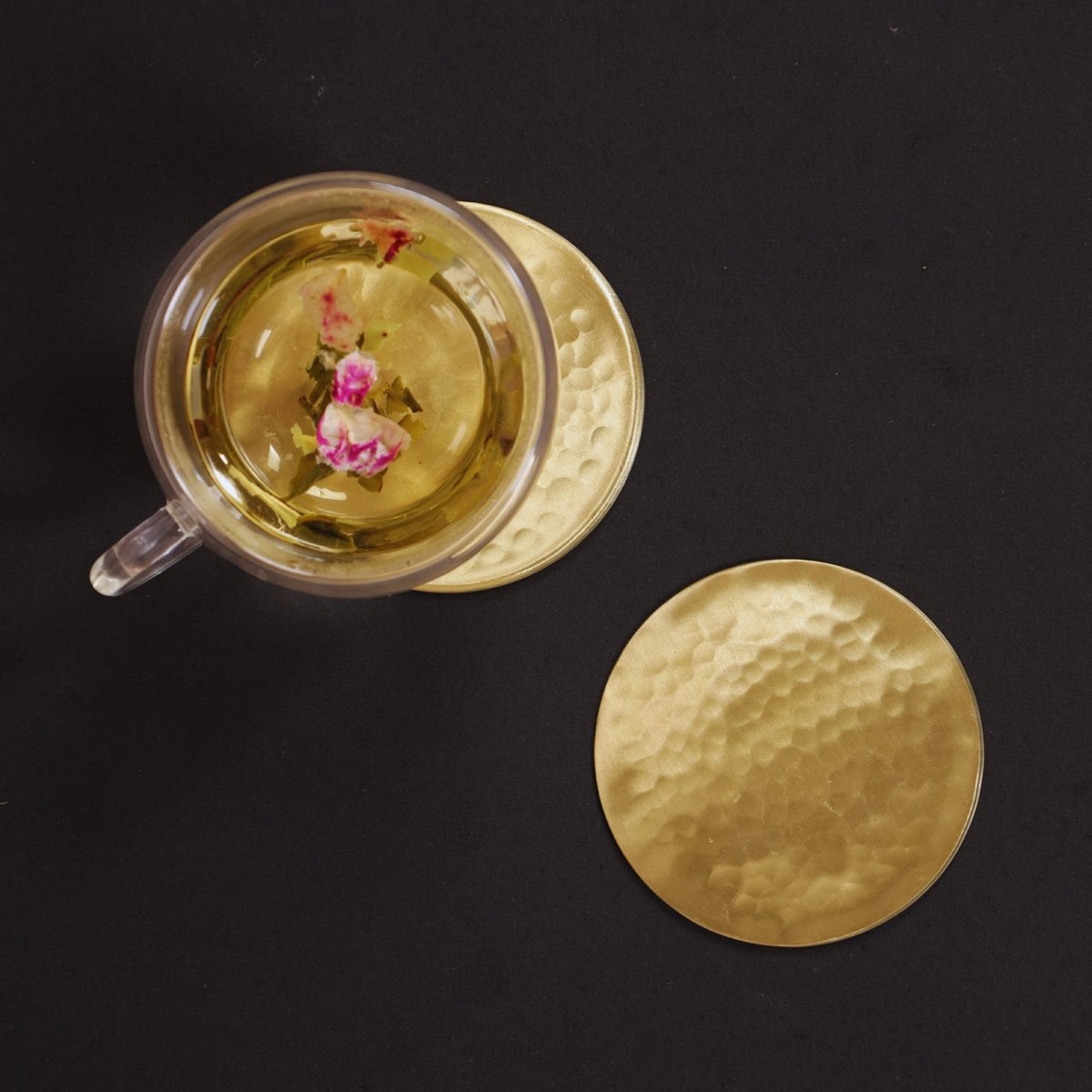 Handcrafted Pure Brass table coaster set with traditional etching, ideal for kitchen and table, adding timeless Indian elegance.