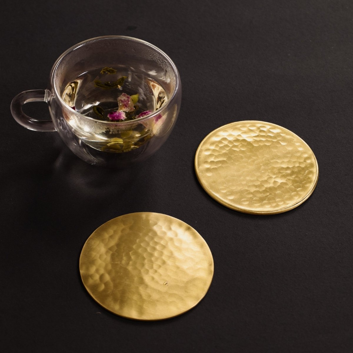 Handcrafted Pure Brass table coaster set with traditional etching, ideal for kitchen and table, adding timeless Indian elegance.