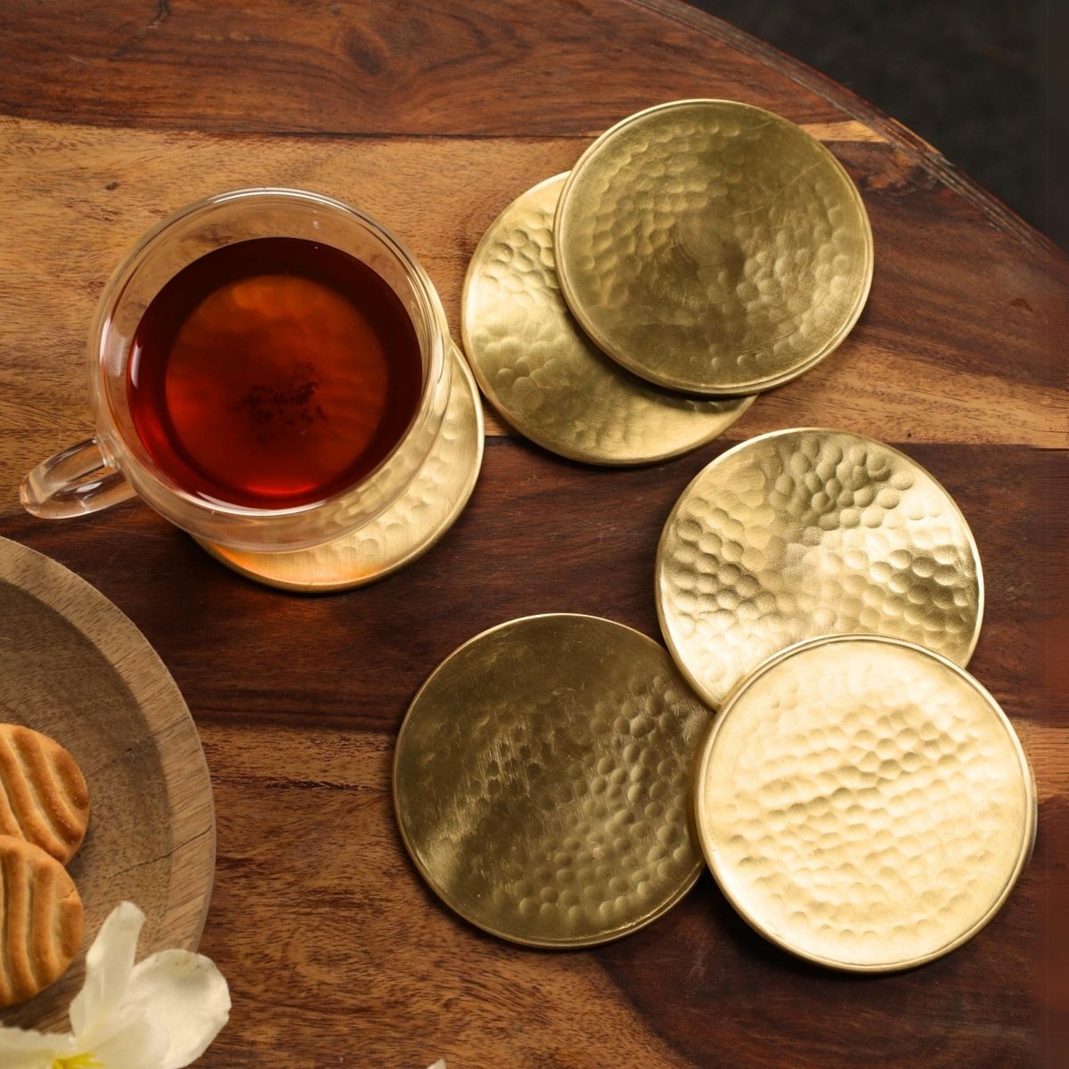 Handcrafted Pure Brass table coaster set with traditional etching, ideal for kitchen and table, adding timeless Indian elegance.