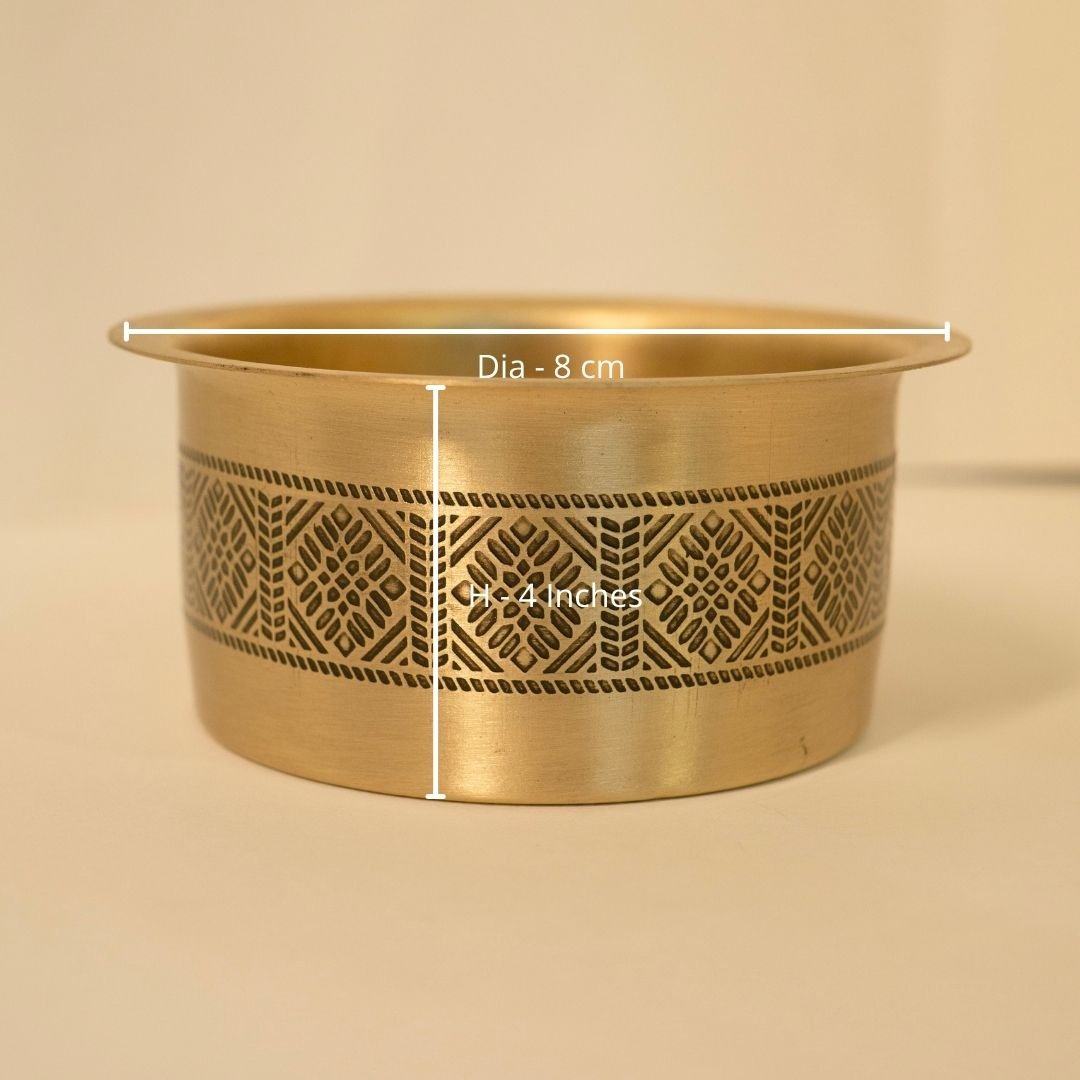 Handcrafted pure brass kitchen masala box with Kanjeevaram-inspired etching, adding timeless Indian elegance.