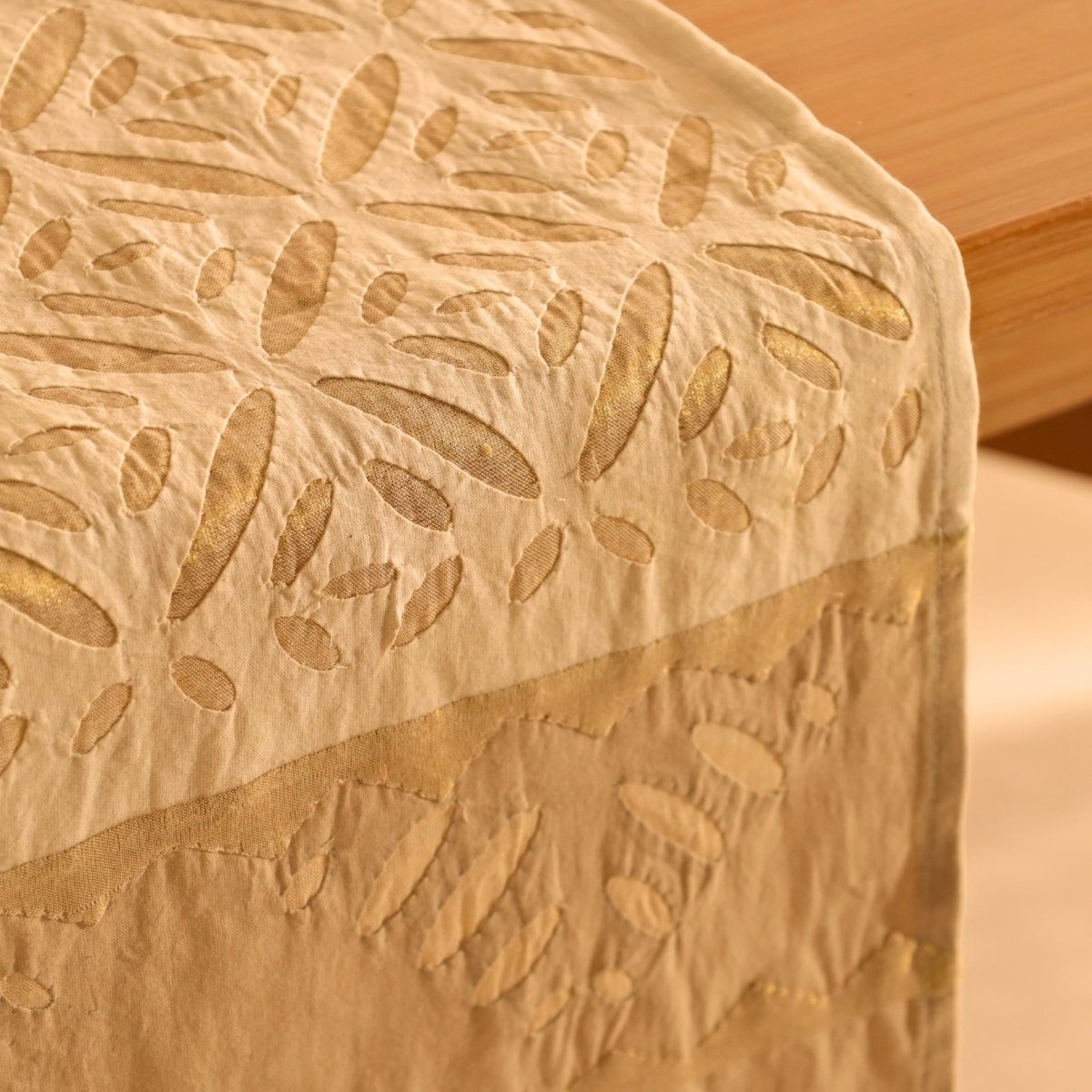 Elegant off white and taupe table runner featuring intricate appliqué work. Handcrafted for timeless dining décor—perfect for modern and classic homes.