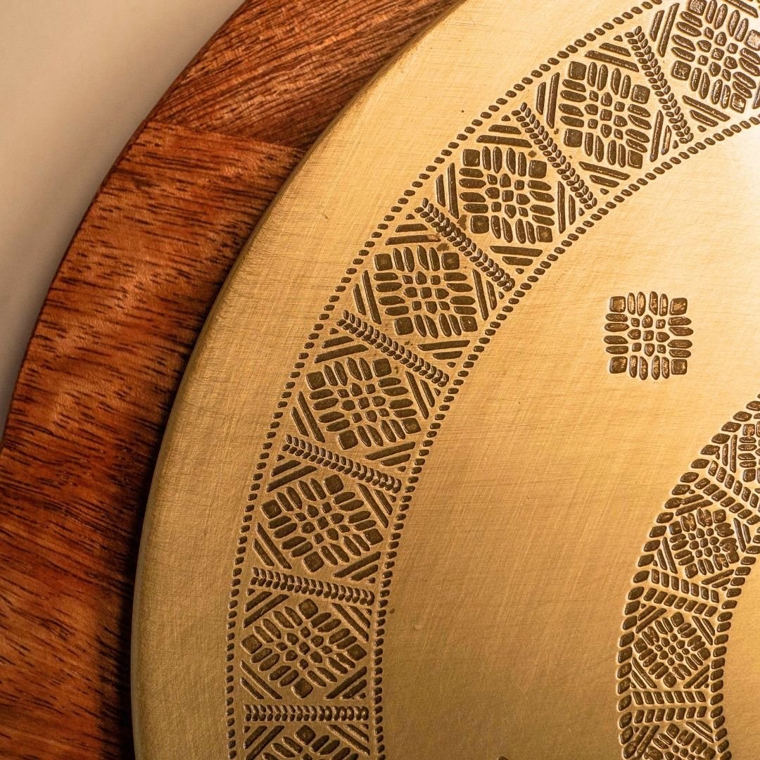 Handcrafted pure brass kitchen masala box with Kanjeevaram-inspired etching, adding timeless Indian elegance.