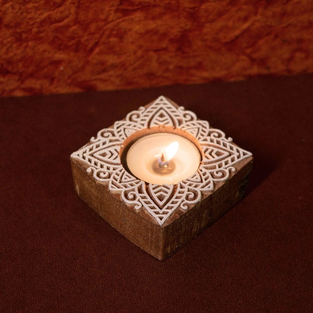 Hand-engraved mango wood diya set with tea lights in white and brown, set of 4, ideal for festive home décor and gifting.