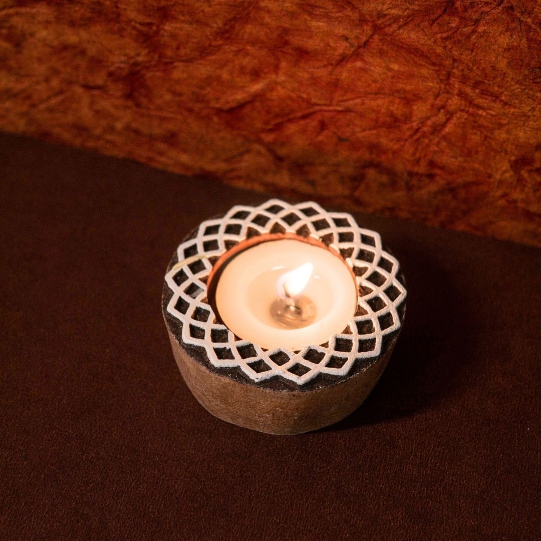 Hand-engraved mango wood diya set with tea lights in white and brown, set of 4, ideal for festive home décor and gifting.