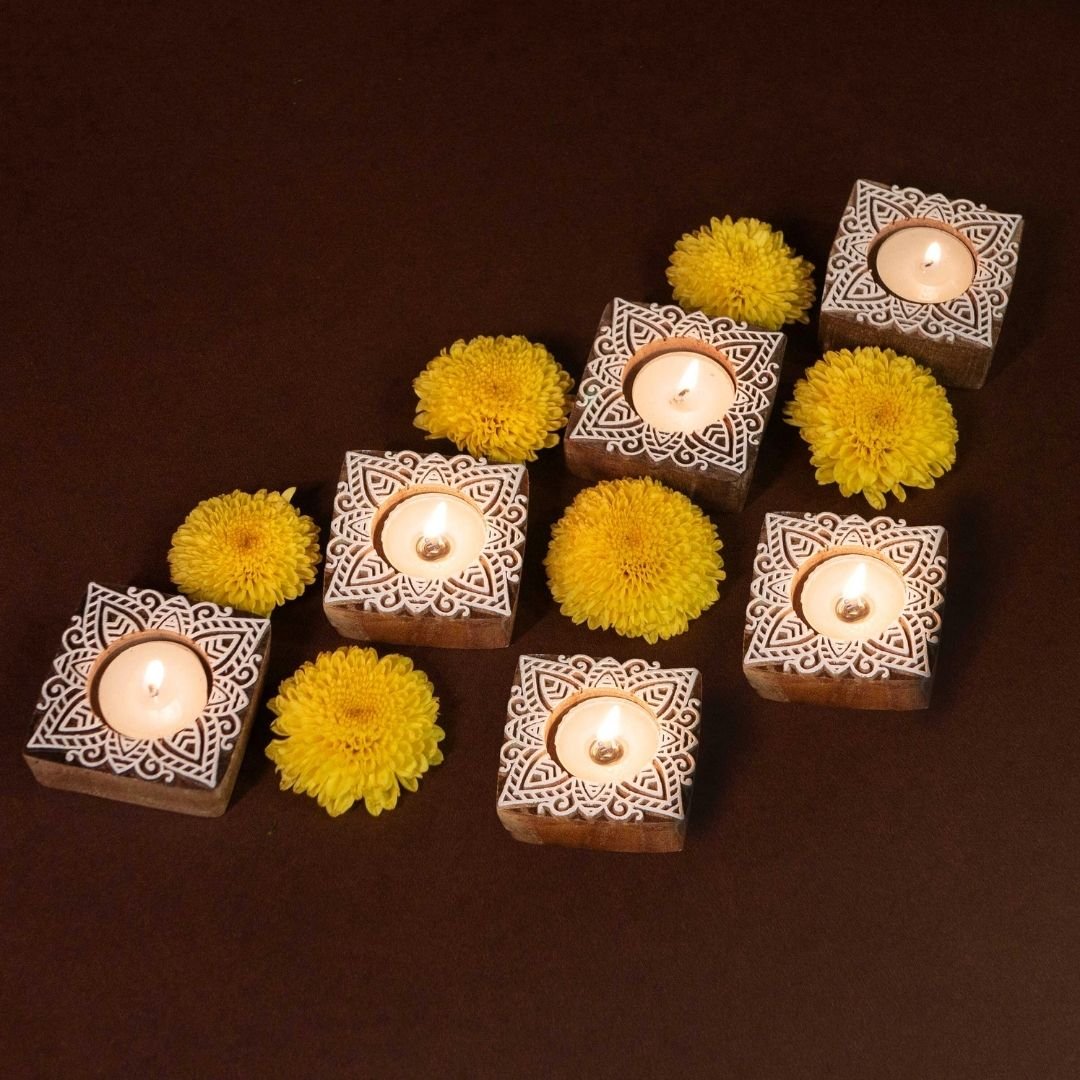 Hand-engraved mango wood diya set with tea lights in white and brown, set of 6, ideal for festive home décor and gifting.