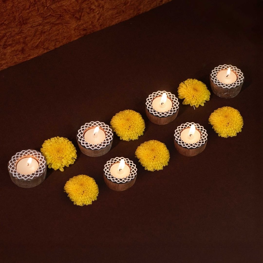Hand-engraved mango wood diya set with tea lights in white and brown, set of 6, ideal for festive home décor and gifting.