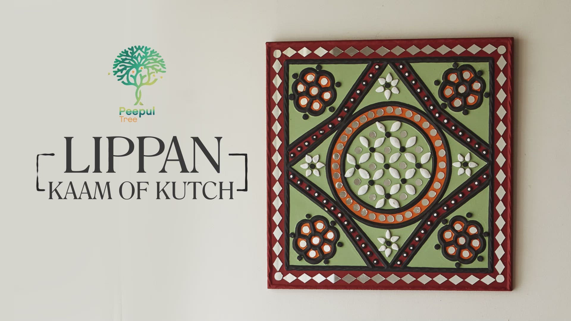 Green and brown handcrafted mud and mirror work wall art, featuring a harmonious blend of colors 